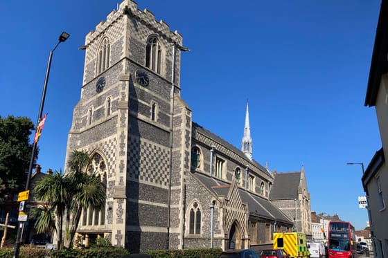 St John the Baptist church on Chipping Barnet High Street, its flint-chequer tower and spire